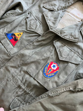 Load image into Gallery viewer, WWII U.S. Army M-1943 Field Jacket With Theater Made Hell on Wheels Stencil