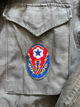 Load image into Gallery viewer, WWII U.S. Army M-1943 Field Jacket With Theater Made Hell on Wheels Stencil